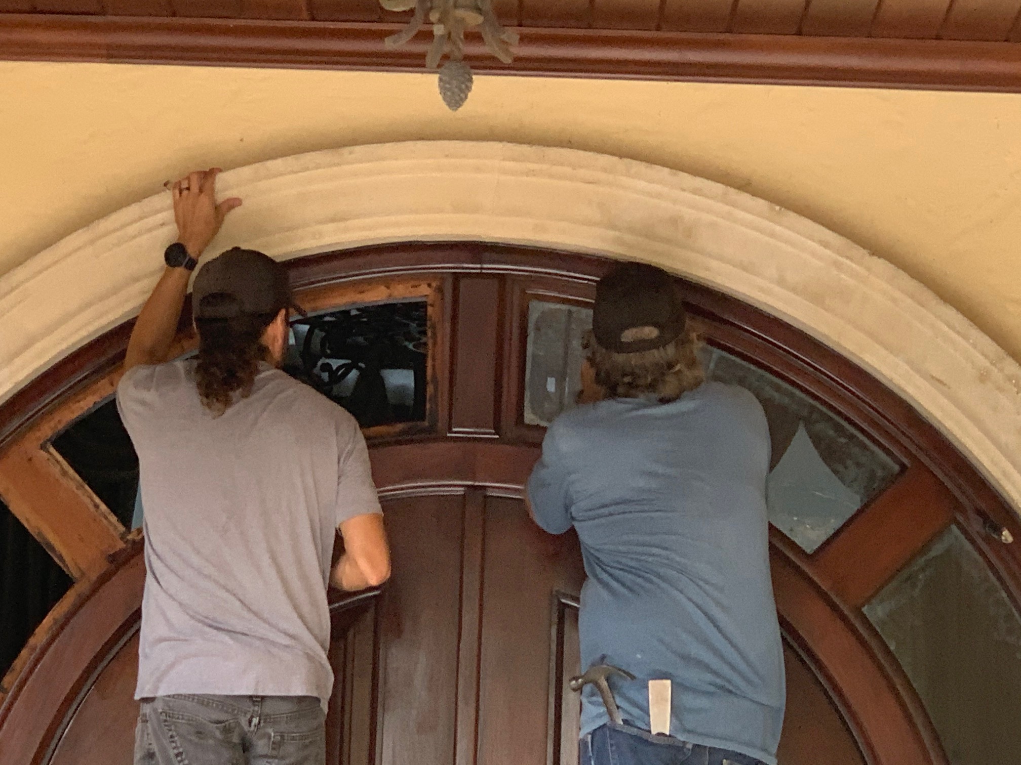 delaminated impact glass replacement in a wood entry door.
